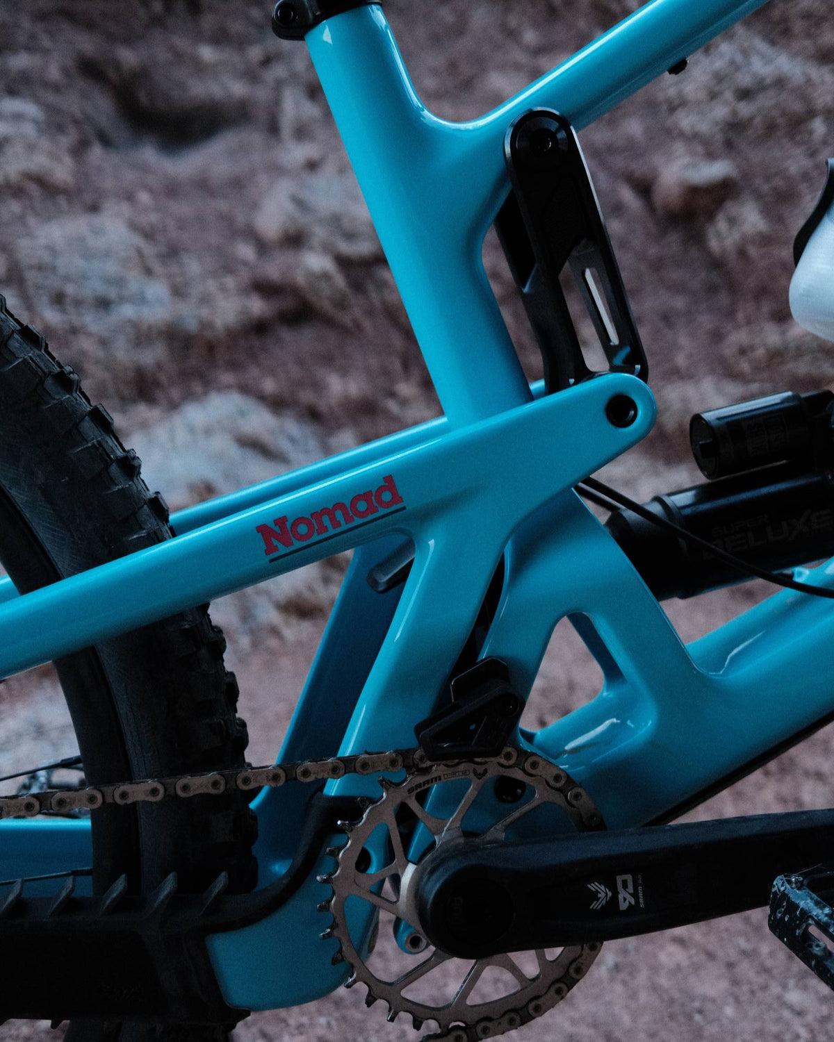 Rear shock and VPP linkage close-up on a Gloss Aqua Magenta 2027 Santa Cruz Nomad