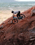 Rider descending a steep red rock slope on a 2027 Santa Cruz Nomad in Arizona