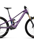 A purple full-suspension mountain bike with black Maxxis tires and a gold Fox fork, shown from a side profile on a white background.