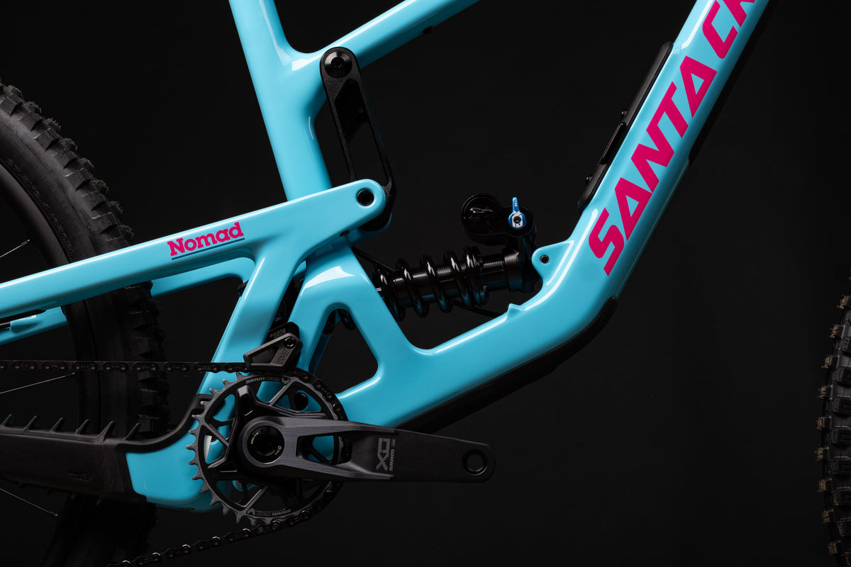Santa Cruz Nomad carbon frame detail in Gloss Aqua Magenta