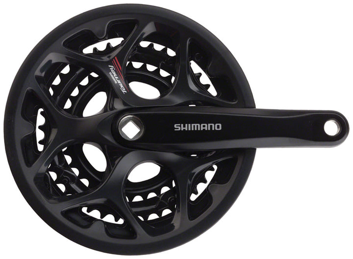 Juego de bielas Shimano Tourney FC-A073 (170 mm, 7/8 velocidades, 50/39/30 dientes, cono cuadrado remachado, interfaz JIS, negro, con protector de cadena)