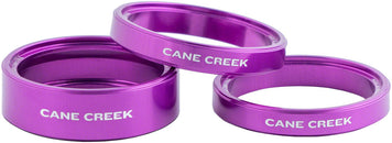 Kit de espaciadores para auriculares Cane Creek Interlok Chroma Studio (morado, 1 de 10 mm y 2 de 5 mm)